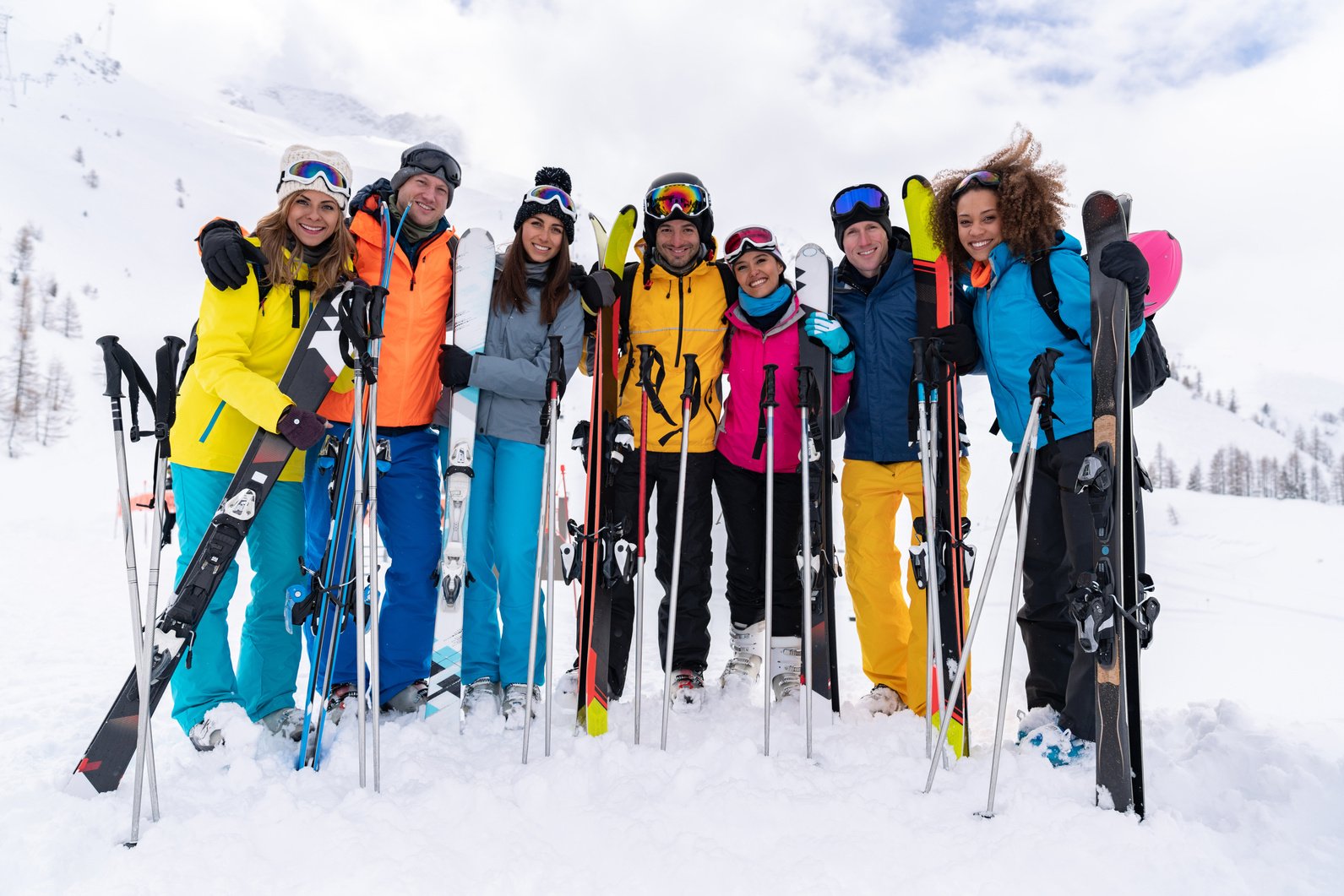 Happy group of friends enjoying their ski trip