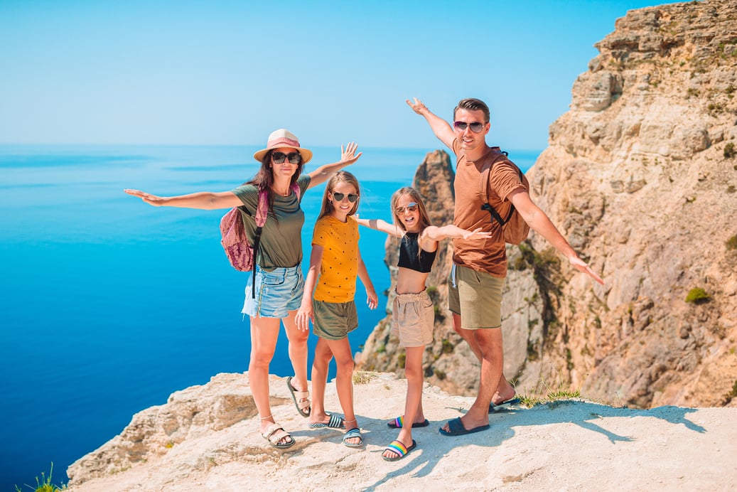 Happy Family on Vacation in the Mountains